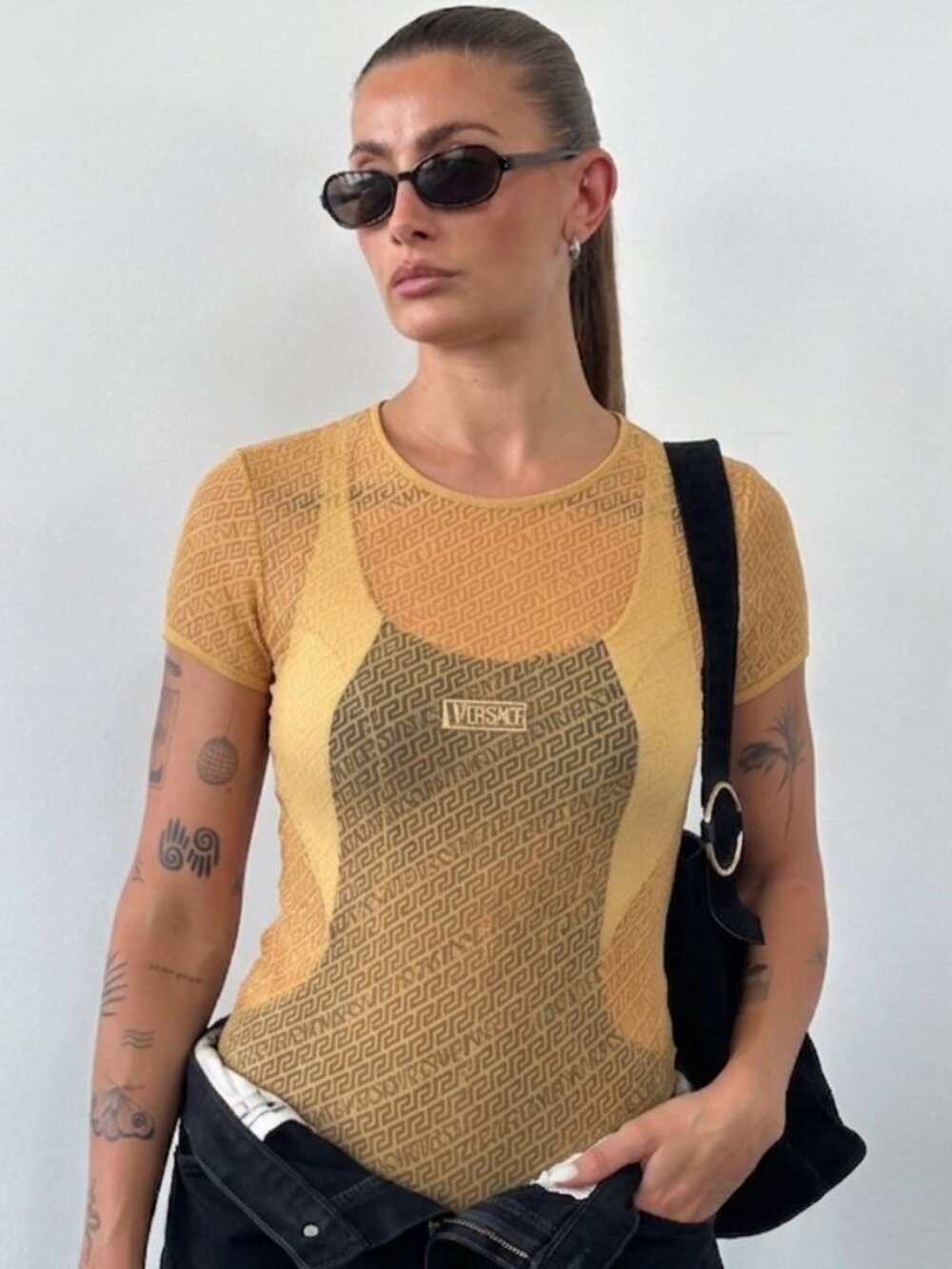 Vintage 1990’s Versace Women's Short Sleeve Textured Tee in Peach